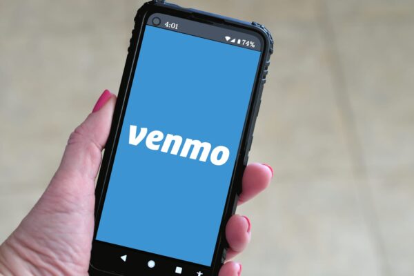 106953450 1633542093442 female holding a mobile phone with venmo logo on screen payment online transfer pay money cash modern t20 7yeL2Z