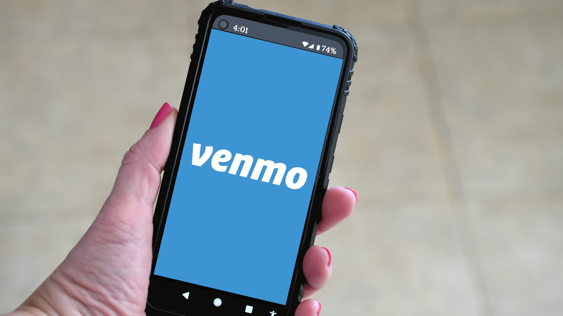 106953450 1633542093442 female holding a mobile phone with venmo logo on screen payment online transfer pay money cash modern t20 7yeL2Z